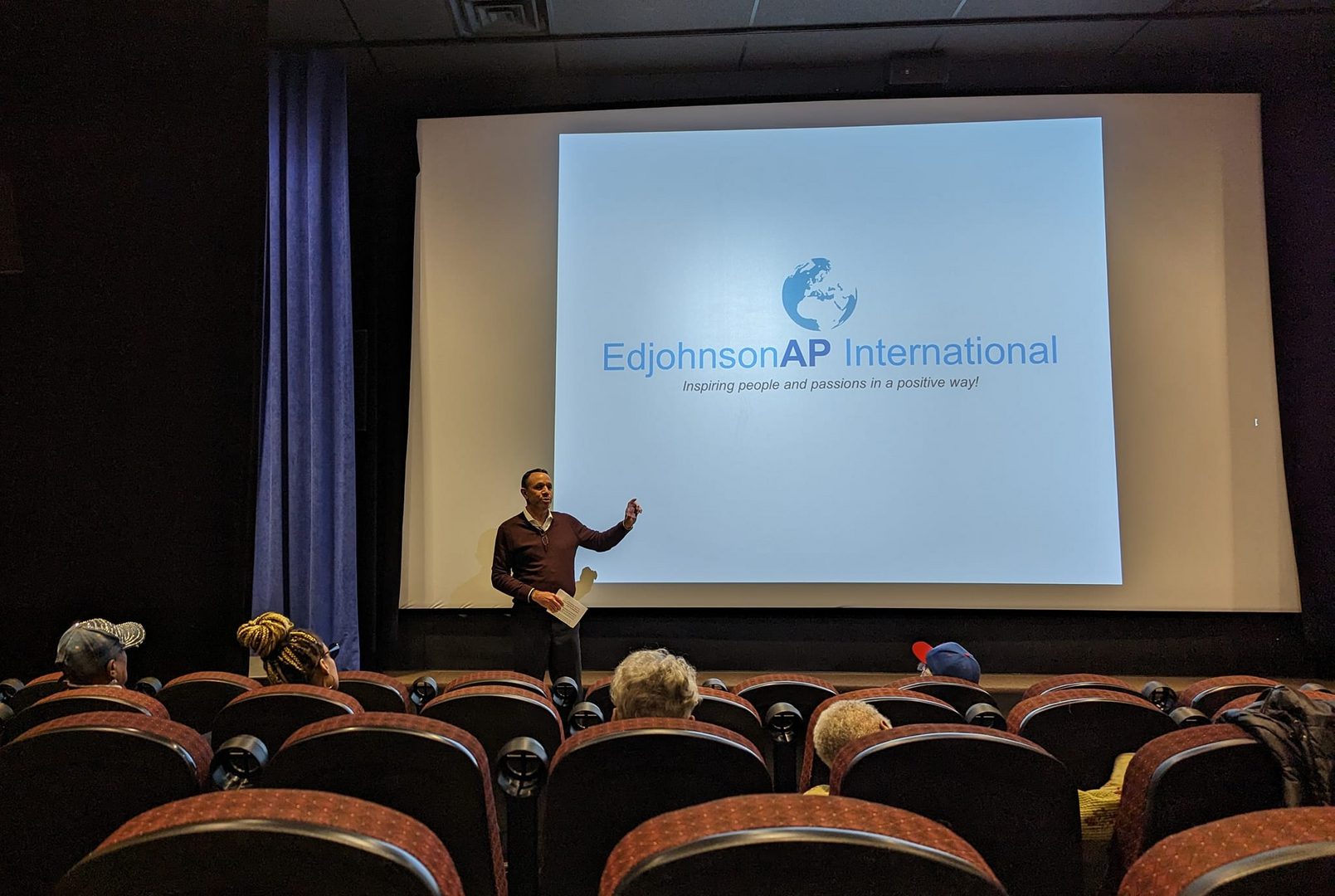 A man is giving a presentation in front of an audience.