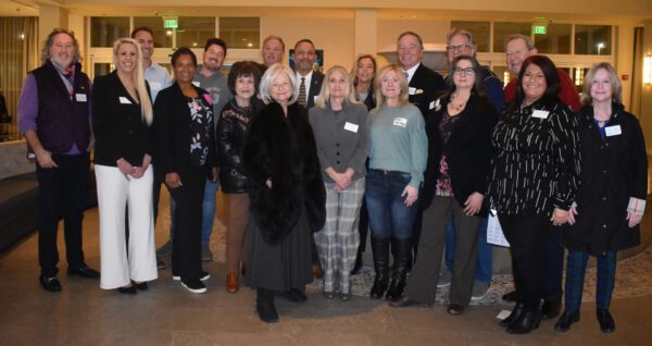 A group of people standing next to each other.