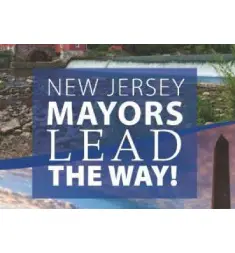 A blue and white sign that says new jersey mayors lead the way.