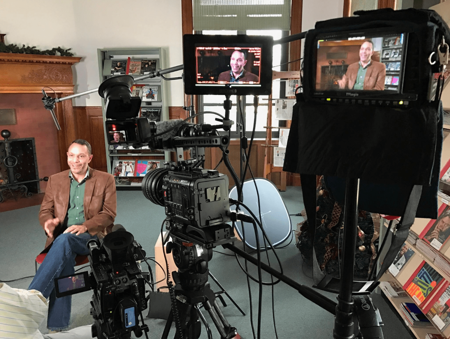 A man sitting in front of a camera.