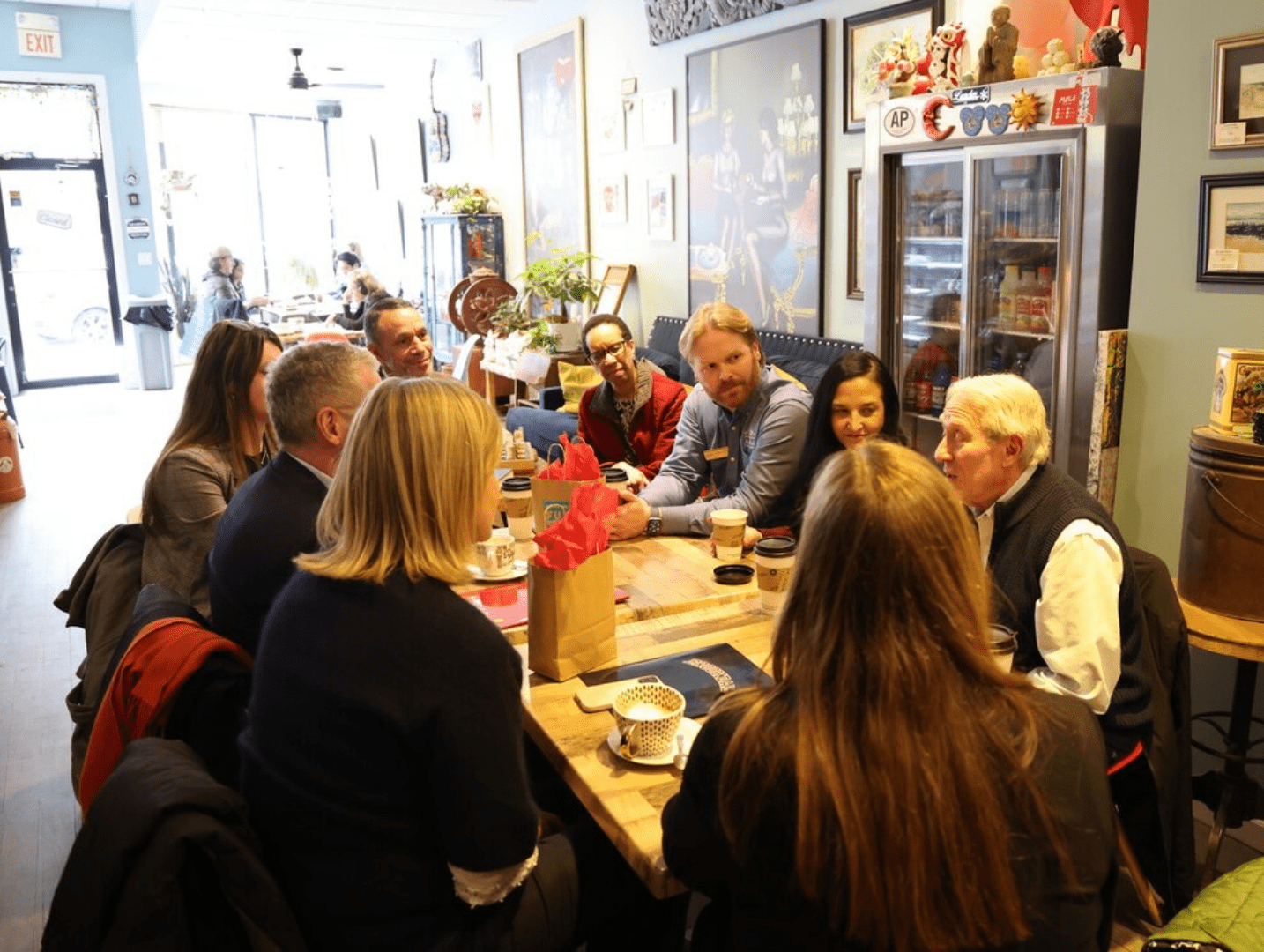A group of people sitting around a table.