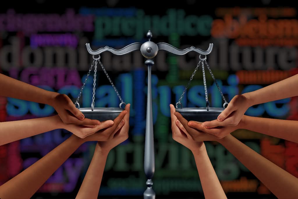 Hands holding scales of justice, colorful background.